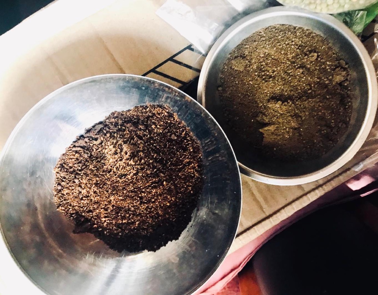 Two steel bowls of freshly ground house spice blends