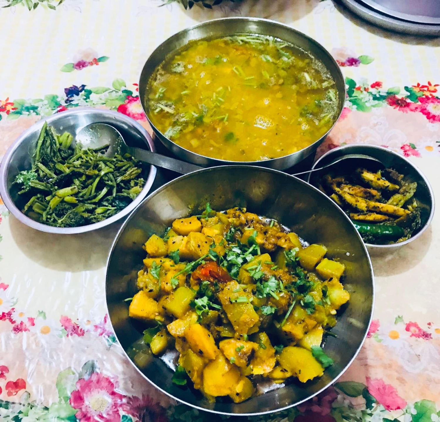 A Nepali thali of dal, tarkari, greens and achar